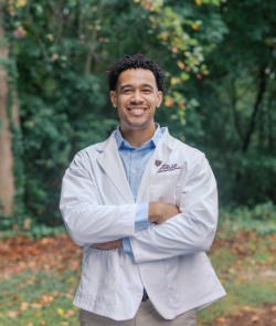 male nursing student smiling at the camera